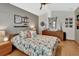Comfortable bedroom with wood floors, ceiling fan, dresser, and modern decor at 2427 Beck Cir, Deltona, FL 32738