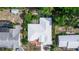 Aerial shot of a home highlighting the roof and surrounding lush greenery at 2466 Candlewick St, Deltona, FL 32738