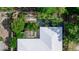 Aerial view showcases a well-maintained roof and lush backyard at 2466 Candlewick St, Deltona, FL 32738