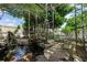 Backyard with a water feature and a wooden walkway at 2466 Candlewick St, Deltona, FL 32738