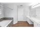 Bright bathroom featuring a tiled soaking tub and vanity with double sinks at 2466 Candlewick St, Deltona, FL 32738