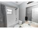 Bathroom featuring a tub, toilet, mirror, and sink at 2466 Candlewick St, Deltona, FL 32738