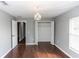 Bedroom with decorative chandelier and access to the closet at 2466 Candlewick St, Deltona, FL 32738