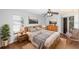 Cozy bedroom with ceiling fan, natural light, and en-suite bathroom at 2466 Candlewick St, Deltona, FL 32738