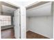 Walk-in closet with shelving and wood-look flooring, with attached bathroom visible at 2466 Candlewick St, Deltona, FL 32738