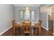 Eat-in dining room features new floors, stylish lighting, and plenty of space at 2466 Candlewick St, Deltona, FL 32738