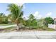A sidewalk view of the property and front yard landscaping at 2466 Candlewick St, Deltona, FL 32738