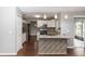 Spacious kitchen features stainless steel appliances, granite countertops, and a stylish tiled backsplash at 2466 Candlewick St, Deltona, FL 32738