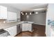 Modern kitchen with stainless steel appliances, breakfast bar, and a stylish backsplash at 2466 Candlewick St, Deltona, FL 32738