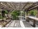 Outdoor pergola sitting area for entertaining on a concrete patio at 2466 Candlewick St, Deltona, FL 32738