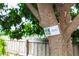 Close-up of a 'Sweet Longan' (Dragon's Eye) tree with signage at 2466 Candlewick St, Deltona, FL 32738