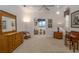Bright bedroom featuring a ceiling fan, a sitting area with water view, and vintage furniture at 2542 S Peninsula Dr, Daytona Beach, FL 32118