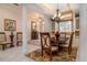 Formal dining room with chandelier lighting and access to the kitchen and living areas at 2542 S Peninsula Dr, Daytona Beach, FL 32118