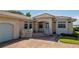 Elegant home featuring a tile roof, arched entryway, and well-manicured landscaping at 2542 S Peninsula Dr, Daytona Beach, FL 32118