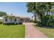 Beautiful single-Gathering home with a spacious front yard and meticulously maintained landscaping at 2542 S Peninsula Dr, Daytona Beach, FL 32118
