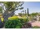 Impressive home facade with a long driveway, lush landscaping, and a gated entrance, showcasing curb appeal at 2542 S Peninsula Dr, Daytona Beach, FL 32118