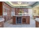 Gourmet kitchen with a central island, wine cooler, and ample cabinet space at 2542 S Peninsula Dr, Daytona Beach, FL 32118