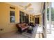 Comfortable screened lanai features ceiling fans and views of the outdoors at 2542 S Peninsula Dr, Daytona Beach, FL 32118