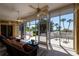 Screened lanai features tile flooring, ceiling fans, and views of the water at 2542 S Peninsula Dr, Daytona Beach, FL 32118