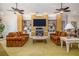 Bright and airy living room featuring a fireplace, built-in shelving, and comfortable sofas at 2542 S Peninsula Dr, Daytona Beach, FL 32118