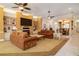 Open living room with a fireplace, built-in shelving, and views into the dining area at 2542 S Peninsula Dr, Daytona Beach, FL 32118