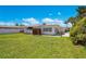 Expansive backyard with lush green grass and privacy fence at 2565 S Peninsula Dr, Daytona Beach, FL 32118