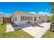 Backyard patio with stone pavers, outdoor seating, and lush landscaping at 2565 S Peninsula Dr, Daytona Beach, FL 32118