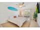 Bright bedroom with a surfboard wall decoration and a neutral color scheme at 2565 S Peninsula Dr, Daytona Beach, FL 32118