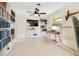 Inviting living room with ceiling fan, piano, decorative shelving, and natural light at 2565 S Peninsula Dr, Daytona Beach, FL 32118