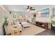 Comfortable living room with shutters, a ceiling fan, and entertainment center with a large screen TV at 2565 S Peninsula Dr, Daytona Beach, FL 32118