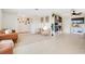 Open-concept living room with tile floors, brown leather sofa, and modern decor at 2565 S Peninsula Dr, Daytona Beach, FL 32118