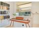 Bright living space featuring a keyboard and a bookshelf with a view to the exterior at 2565 S Peninsula Dr, Daytona Beach, FL 32118