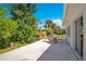 Spacious patio with an outdoor dining area and views of the surrounding landscaping at 2565 S Peninsula Dr, Daytona Beach, FL 32118