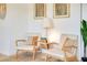 Cozy sitting area featuring comfortable armchairs, stylish side table, and modern decor at 2565 S Peninsula Dr, Daytona Beach, FL 32118