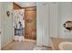 Bathroom featuring shower with river rock base, and tiled niche for storage at 261 Clydesdale Cir, Sanford, FL 32773