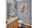 Charming half bathroom featuring stylish wall art and modern fixtures at 261 Clydesdale Cir, Sanford, FL 32773