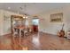 Elegant dining room with hardwood floors, wooden table, chairs, and charming furnishings at 261 Clydesdale Cir, Sanford, FL 32773