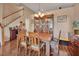 Stylish dining area with hardwood floors, wooden table, and charming built-in cabinet at 261 Clydesdale Cir, Sanford, FL 32773