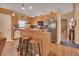Functional kitchen with modern stainless steel appliances, a breakfast bar, and ample cabinet space at 261 Clydesdale Cir, Sanford, FL 32773