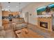 Inviting living space with fireplace open to kitchen, and large television at 261 Clydesdale Cir, Sanford, FL 32773
