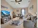 Comfortable living room with two sofas, ceiling fan, area rug, and large screen television at 261 Clydesdale Cir, Sanford, FL 32773