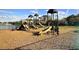 Community playground with multiple slides, climbing structures, and a safety ground covering at 261 Clydesdale Cir, Sanford, FL 32773