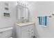 Bright bathroom featuring a clean design with a white vanity, toilet, and modern fixtures at 2626 S Atlantic Ave # 1080, Daytona Beach, FL 32118