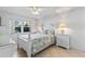 Inviting bedroom with a bright floral bedding, and views of tropical landscape at 2626 S Atlantic Ave # 1080, Daytona Beach, FL 32118