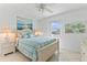 Comfortable bedroom with matching nightstands, a large window with scenic views, and seaside decor at 2626 S Atlantic Ave # 1080, Daytona Beach, FL 32118