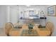 Dining area with wood table adjacent to an updated kitchen at 2626 S Atlantic Ave # 1080, Daytona Beach, FL 32118