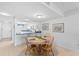 Cozy dining area with wood table, tile floors, and open to kitchen at 2626 S Atlantic Ave # 1080, Daytona Beach, FL 32118