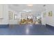 Open dining area with a table set for four, flowing into a living area and views of a pool outside at 2626 S Atlantic Ave # 1080, Daytona Beach, FL 32118