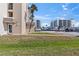 Exterior shot of building showing ground floor access and grass at 2626 S Atlantic Ave # 1080, Daytona Beach, FL 32118