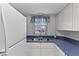 Updated kitchen with white cabinets, and stainless sink by the window at 2626 S Atlantic Ave # 1080, Daytona Beach, FL 32118